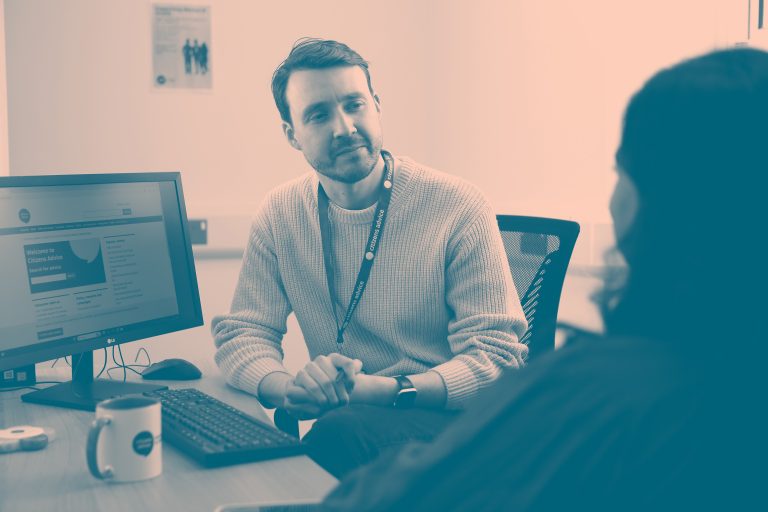 An adult adviser talking to a woman.